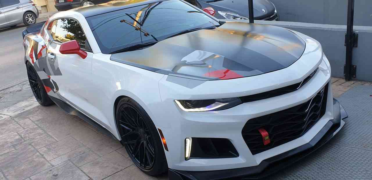 Chevrolet Camaro — white geometric-camo printed wrap, shop gallery.